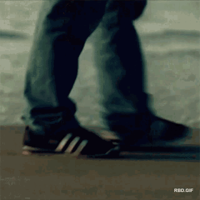 a person 's feet are shown in a blurry photo with the words rbd.gif below them