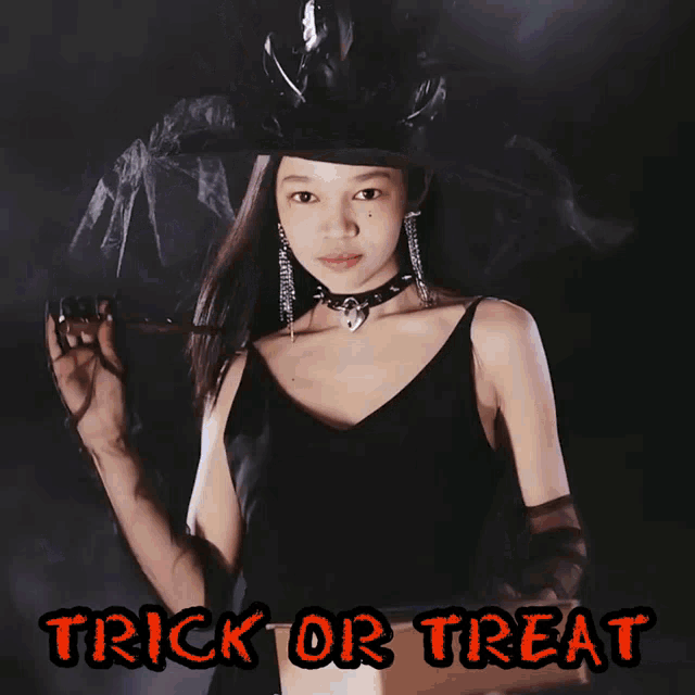 a girl in a witch costume is holding a flashlight and the words trick or treat are on the bottom