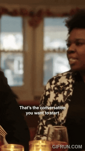 a gif from gifrun.com shows a woman talking to another person