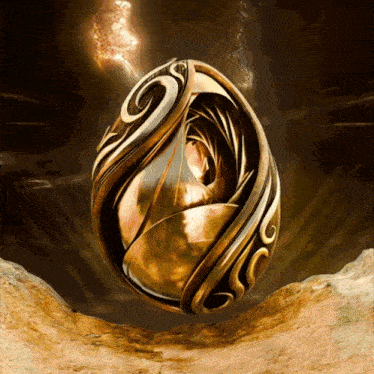 a gold object with a swirl on it