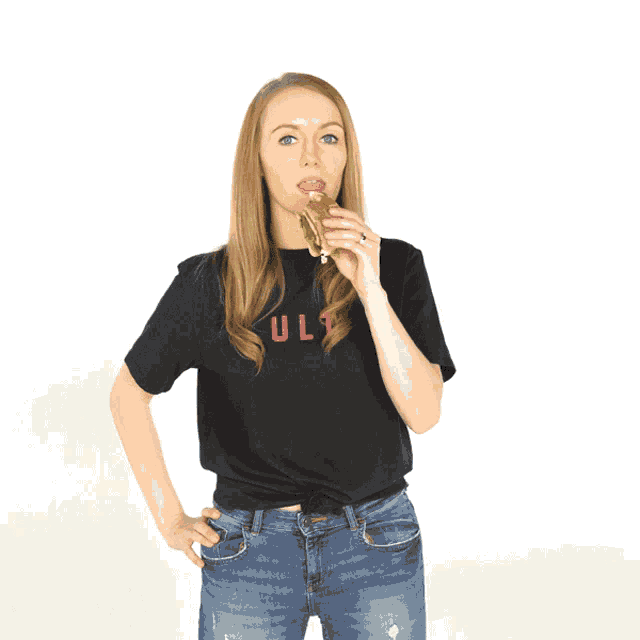 a woman wearing a black shirt that says " ul " on it