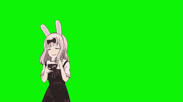 a girl with bunny ears is holding a video game controller .