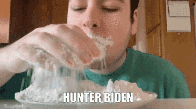 a man in a green shirt is eating food with the words hunter biden written on the plate