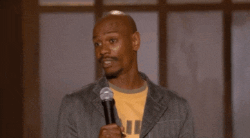 a man is holding a microphone and asking the question word