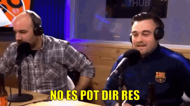 a man wearing headphones says no es pot dir res in front of two microphones
