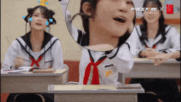 a girl in a sailor suit is sitting at a desk in a classroom with a free fire x logo on the screen