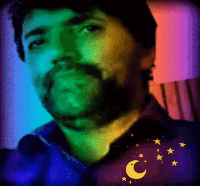 a man with a beard is surrounded by a rainbow of colors
