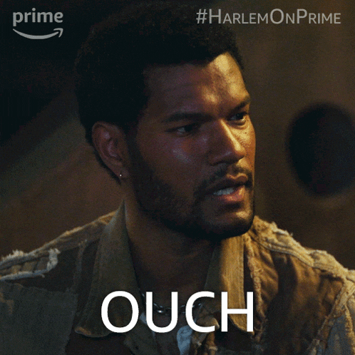 a man with a beard says ouch in front of an amazon logo