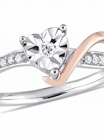 a ring with a heart shaped diamond in the middle