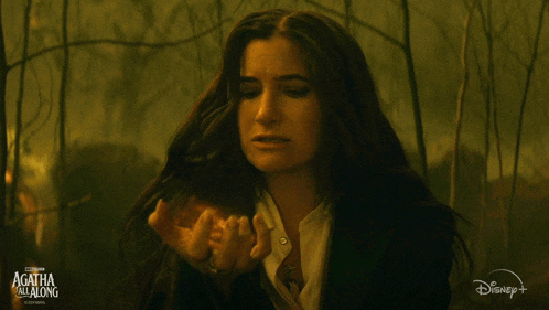 a woman with long hair is in a scene from agatha and the mad hatter