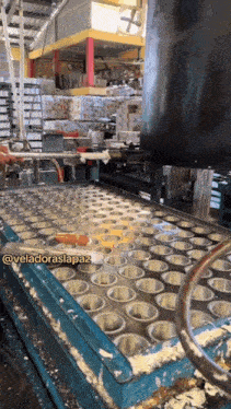 a machine with a bunch of holes in it that says @veladoraslapaz on the bottom