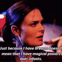 a close up of a woman 's face with the words just because i have breasts