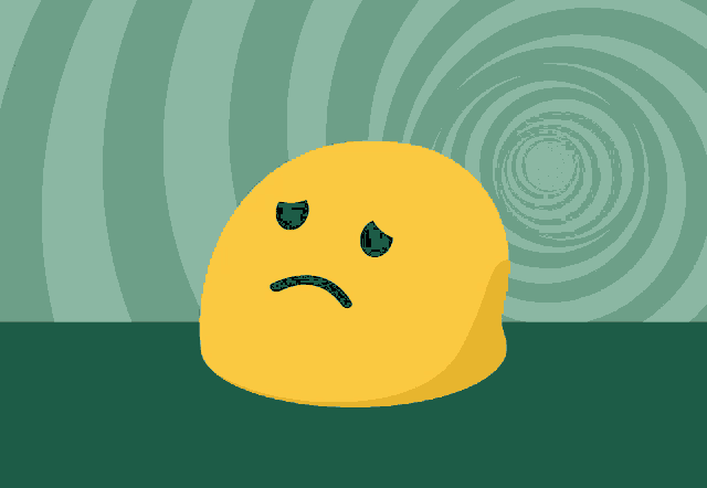 a yellow smiley face with a sad face is sitting on a table