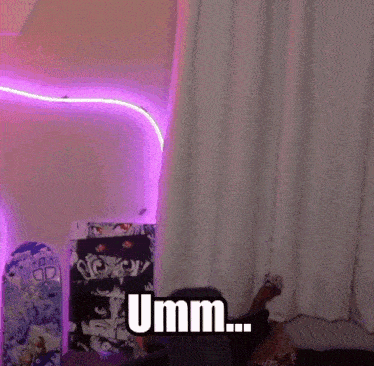 a person sitting in front of a purple light with the word umm on it