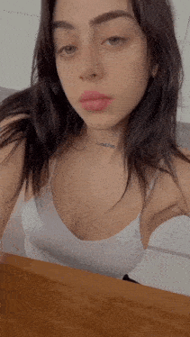 a woman with a tattoo on her neck that says ' i love you '