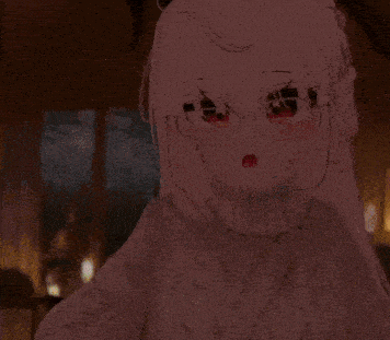 a girl wearing glasses and a sweater is looking at something