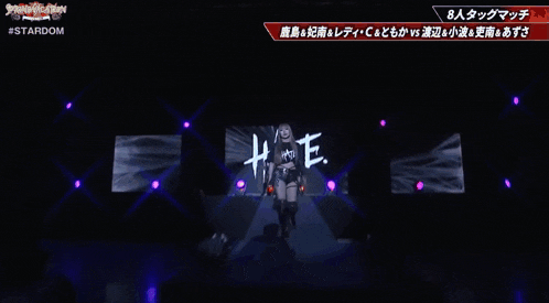 a woman with blonde hair is wearing a black shirt that says stardom on it