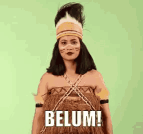 a woman in a native american costume is standing in front of a green background and saying belum !