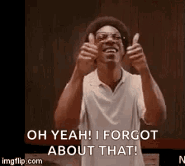 a man is giving two thumbs up and says oh yeah i forgot about that .