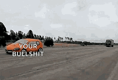 a car is driving down a road next to a truck and says `` your bullshit '' .
