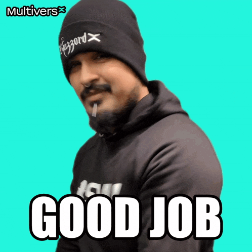 a man with a beard wearing a black beanie and a black hoodie says good job