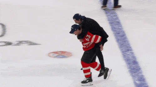 a man is carrying another man on his shoulders with the number 39 on his jersey