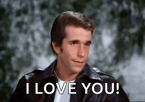 a man in a leather jacket is giving a thumbs up and saying `` i love you '' .