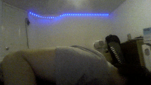 a blurry photo of a person laying on a bed