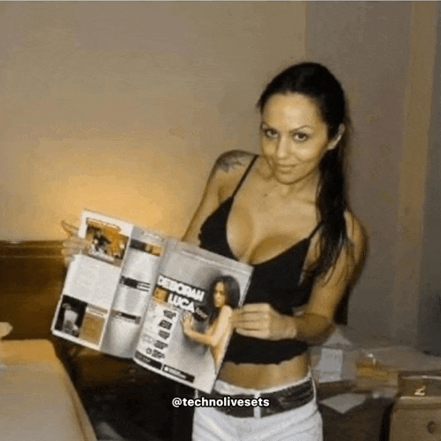 a woman is holding a magazine that says deborah luca on the cover