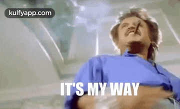 a man is holding a cigarette in his mouth and saying `` it 's my way '' .