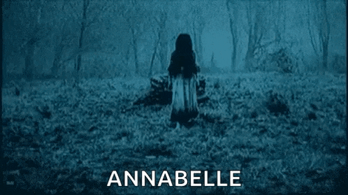 a poster for the movie annabelle shows a ghost coming out of a hole in the wall .