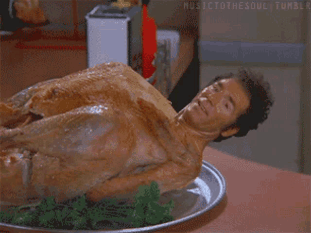 a man laying on top of a turkey on a plate with musictothesoul tumblr written on the bottom