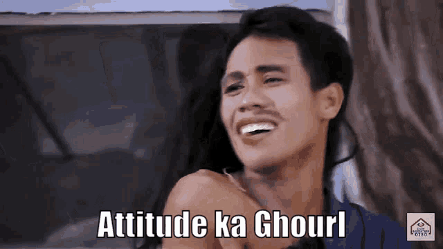 a man is smiling with the words attitude ka ghourl on his face