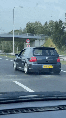 a black car with a license plate that says 68-lx-cp