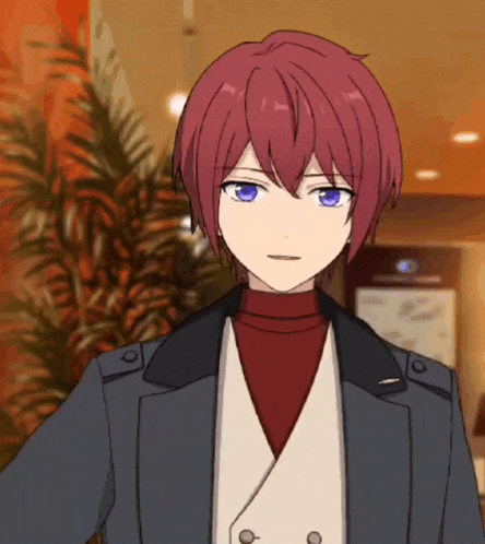 a boy with red hair and blue eyes is wearing a jacket and a white vest .