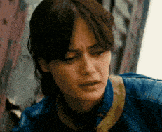 a close up of a woman wearing a blue leather jacket