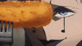 a close up of a woman 's face with a fork holding a fried chicken nugget