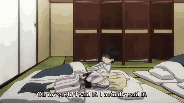 two anime characters laying on a bed with one saying oh my gosh