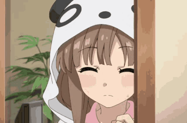 a girl wearing a panda hooded sweatshirt is looking out of a doorway
