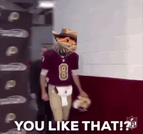 a football player wearing a cowboy hat and a number 8 jersey walks down a hallway