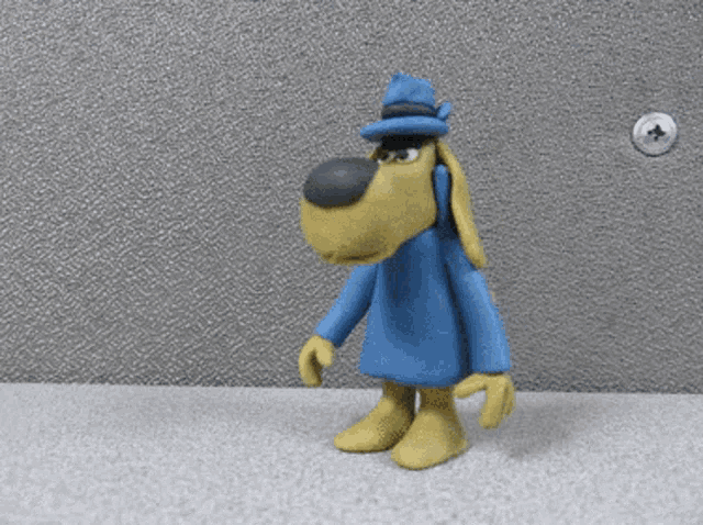 a cartoon dog wearing a blue coat and hat