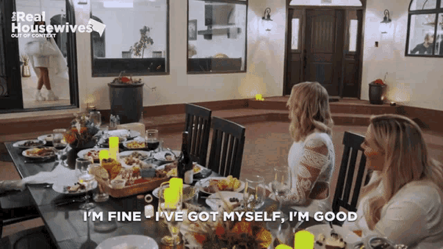 a woman sitting at a table says i 'm fine