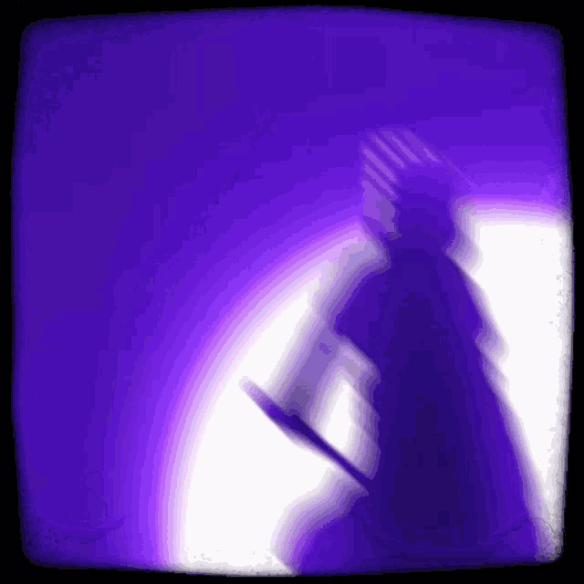a blurry picture of a person holding a sword