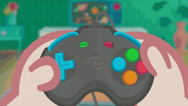a person is holding a video game controller that says mundo bita