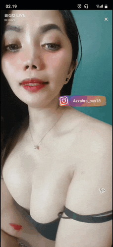 a woman 's breasts are shown on a bigo live screen