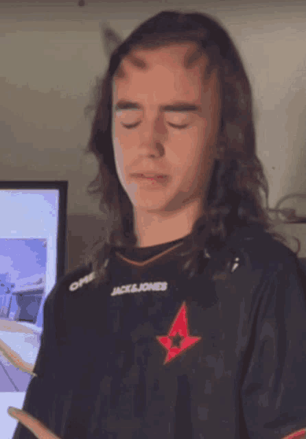 a man with horns on his head wears a jack & jones jersey