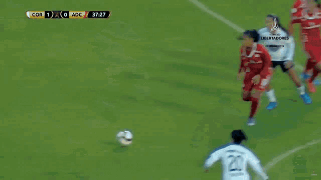 a soccer game is being played and the score is cor 1-0 adc