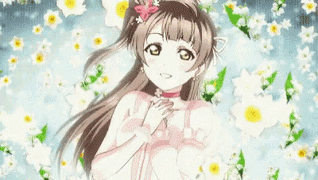 a girl in a pink dress is surrounded by flowers .