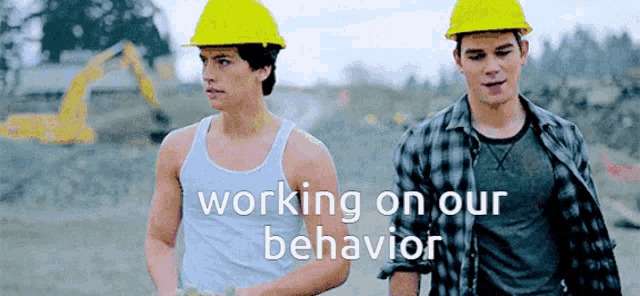 two men wearing hard hats are standing next to each other with the words " working on our behavior " written below them