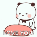 a panda bear is sitting on a pink pillow with the words `` love you '' written on it .